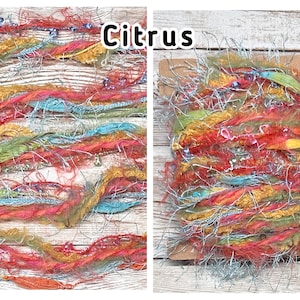 May include: A colourful bundle of textured yarn in shades of orange, red, yellow, green, and blue, with silver metallic strands. The word "Citrus" is displayed in the image. This yarn is suitable for various craft projects.