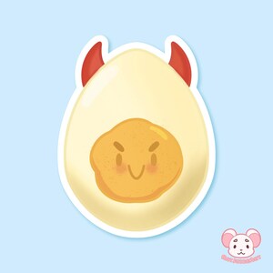 May include: A cartoon illustration of a white egg with a yellow yolk and red devil horns. The yolk has a mischievous expression with a smile and angry eyebrows.