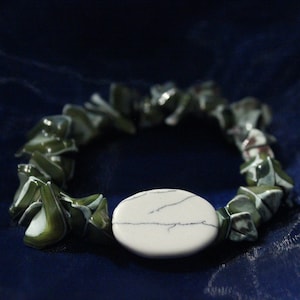 Handmade ocean-themed green stretch bracelet.