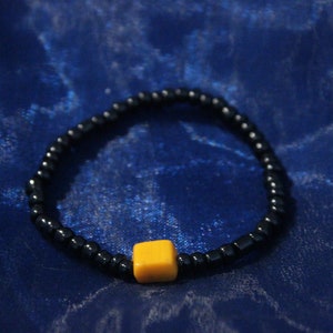 Handmade caramel candy-themed glass bracelet.