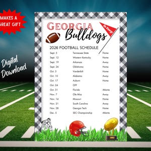May include: A rectangular 2026 Georgia Bulldogs football schedule print featuring a black and white buffalo check border. The text includes team names, dates, and locations. Graphics include a football, a red pennant, a bulldog, a helmet, and a trophy.