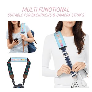May include: A light blue strap with cartoon animal designs, suitable for backpacks and camera straps. The strap is shown on a backpack and a purse. The text "MULTI FUNCTIONAL SUITABLE FOR BACKPACKS & CAMERA STRAPS" is at the top of the image.