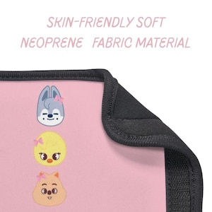 May include: Pink neoprene fabric with a black border, featuring three cartoon animal characters with pink bows. The text "SKIN-FRIENDLY SOFT NEOPRENE FABRIC MATERIAL" is printed in light pink.