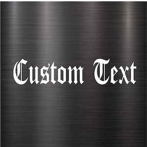 May include: White text on a brushed metal background that reads "Custom Text" in a gothic font.