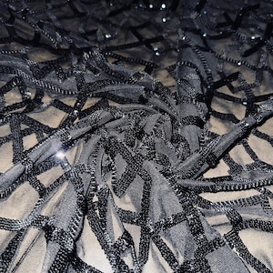Uniform geometric black sequins embroidered on mesh