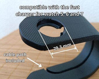 May include: Black 3D-printed watch charger stand. Compatible with the fast charger for watch 5, 6, and 7. The opening is 2.93 cm wide. The text "cable path included" is visible.