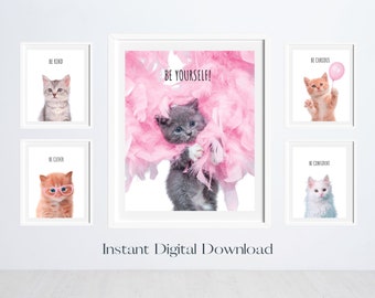 May include: Set of five printable wall art prints featuring cute kittens with inspirational messages. The prints feature a gray kitten in pink feathers with the message "Be Yourself!" and four other kittens with the messages "Be Kind", "Be Clever", "Be Curious", and "Be Confident".