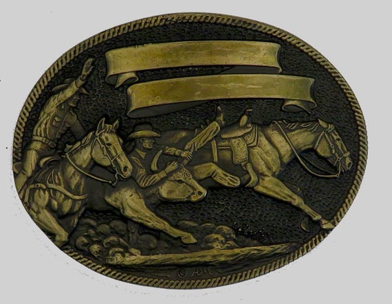 Rodeo belt buckle by ADM Inc bringing down the bull.