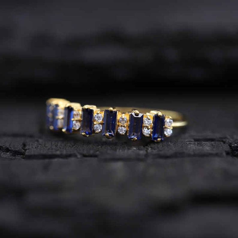 Stunning natural sapphire diamond eternity ring, destined to be treasured forever.
Captivating blue sapphire and diamond eternity ring, a symbol of eternal love and commitment.