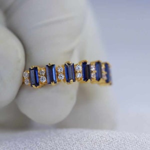 Timeless blue sapphire and diamond eternity ring, a classic choice for any occasion.
Luxurious natural sapphire diamond eternity ring, perfect for marking significant milestones.
Mesmerizing blue sapphire diamond eternity ring,