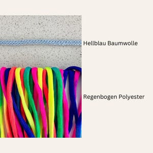 May include: Two types of cord, one light blue and the other a rainbow of colors. The light blue cord is labeled "Hellblau Baumwolle" and the rainbow cord is labeled "Regenbogen Polyester".