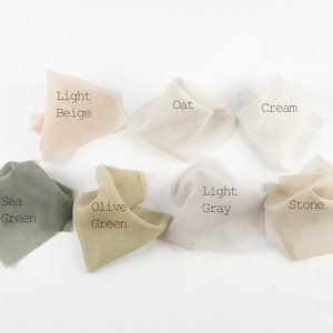 May include: Swatch cards showing ten different fabric colors: Light Beige, Oat, Cream, Sea Green, Olive Green, Light Gray, Stone, Dusty Rose, Charcoal, and Black.