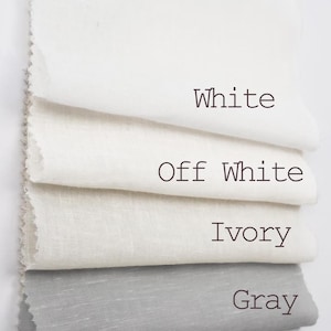 May include: Four rectangular fabric swatches stacked vertically, featuring distinct color variations labeled with text: White, Off White, Ivory, and Gray. Each piece of material displays a visible woven texture with raw, slightly frayed edges on the left side.
