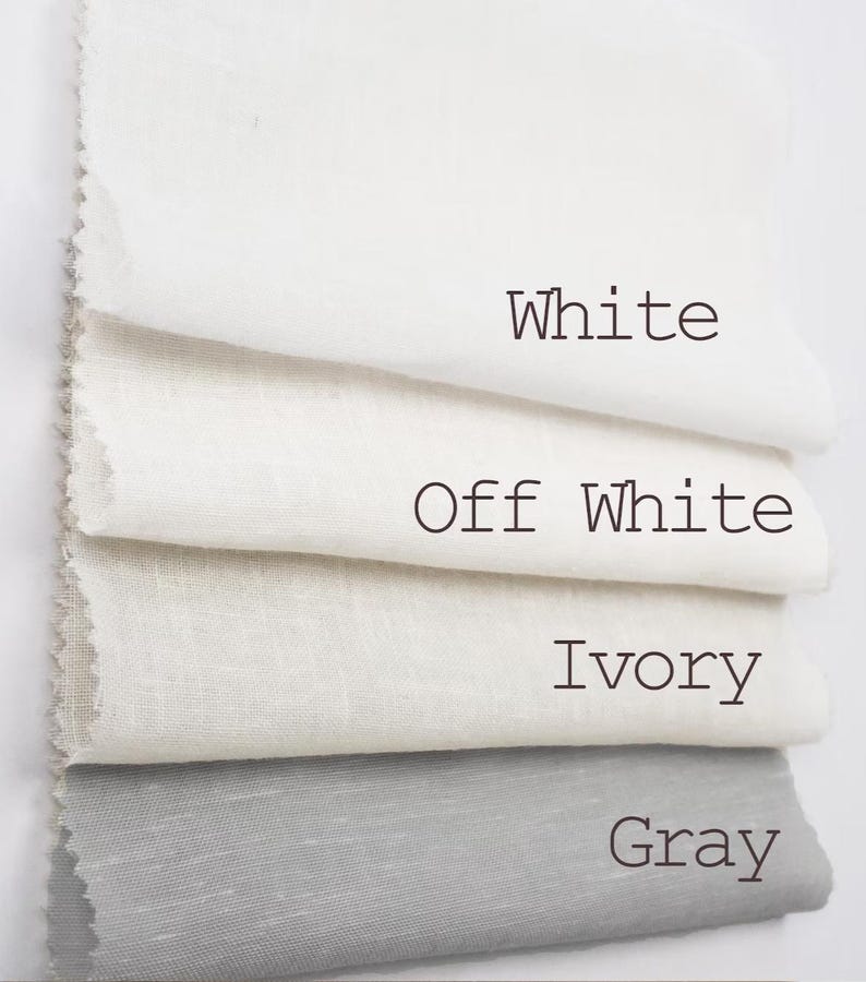 May include: Four rectangular fabric swatches stacked vertically, featuring distinct color variations labeled with text: White, Off White, Ivory, and Gray. Each piece of material displays a visible woven texture with raw, slightly frayed edges on the left side.