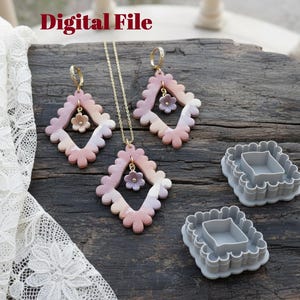 May include: A jewelry set featuring a necklace and earrings with a diamond-shaped design in pink, peach, and white. Each piece has a small flower charm. Two gray, square-shaped cutters are also present. The text "Digital File" is visible.