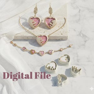 May include: A collection of heart-shaped jewelry and cookie cutters. The jewelry includes earrings, a necklace, and a bracelet, all with gold-colored metal and pink accents. The cookie cutters are white and also heart-shaped. The text "Digital File" is visible.