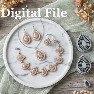 May include: A jewelry set and teardrop-shaped cutters are displayed on a marble tray. The set includes a necklace, earrings, ring, and bracelet, all with a beige and pink pattern. The words "Digital File" are at the top of the image.