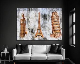 May include: A three-panel wall art print featuring watercolor-style illustrations of Big Ben, the Eiffel Tower, and the Leaning Tower of Pisa in shades of brown and gold against a textured, abstract gray and white background.