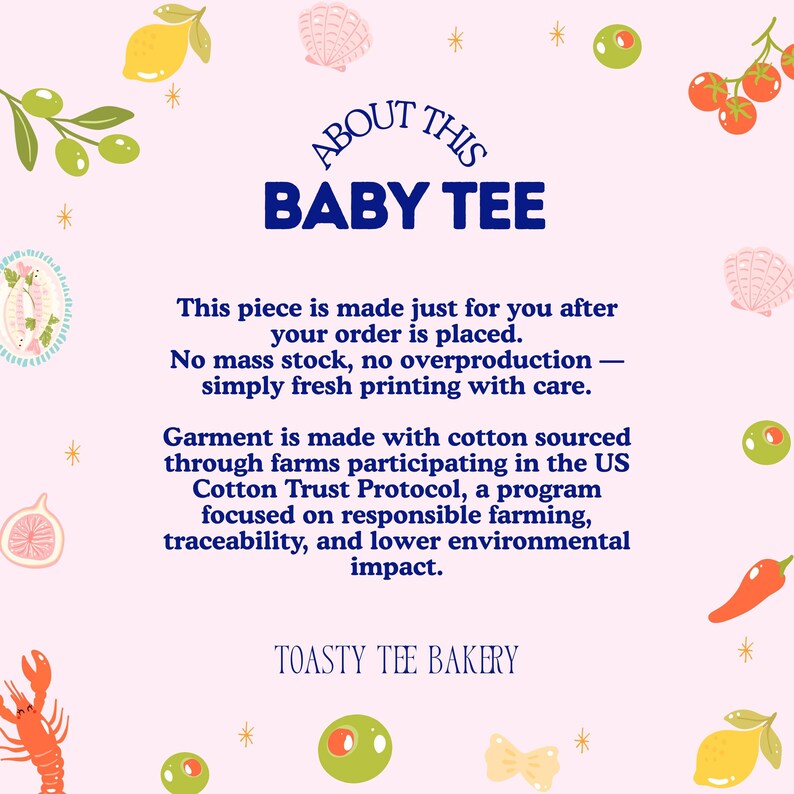 May include: A light pink informational graphic titled ABOUT THIS BABY TEE. It features dark blue text detailing made-to-order production and US Cotton Trust Protocol sourcing. The border is decorated with illustrations of lemons, olives, tomatoes, shells, and a lobster.