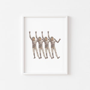 May include: A framed print of a digital illustration of four figures in a line, all with their arms raised in the air. The figures are nude and have a light brown skin tone. The background is white.