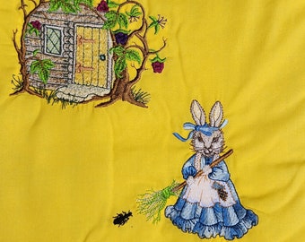 Edredón bordado a mano: diseño de conejito y cabaña.
