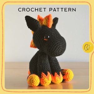 May include: A crocheted unicorn toy with a black body, orange and yellow mane, and matching feet. The image displays the text "CROCHET PATTERN". The unicorn has large black eyes and is sitting on a wooden surface.