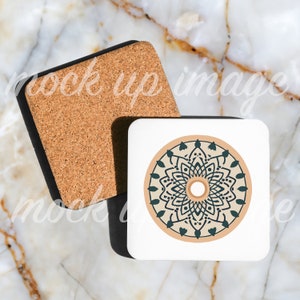 May include: Two square cork coasters, one with a black border and a beige cork surface, and the other with a white surface and a black border. The white coaster features a black and teal mandala design with a beige center.