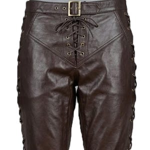 May include: Brown leather pants with a lace-up front and side detailing. The pants feature a buckle closure at the waist and eyelets along the sides for the lacing. The leather has a slight sheen.