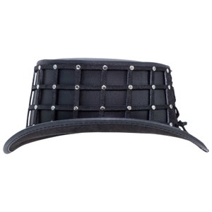 May include: Black top hat with a black leather band and a silver studded grid pattern.