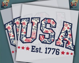 May include: Heat press transfer featuring the word "USA" in a collegiate font, filled with a floral pattern of red flowers and blue leaves. The text "Est. 1776" is below, with red stars. The words "HEAT PRESS" and "DTF READY TO PRESS" are also visible.