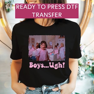 May include: Black t-shirt with a pink graphic of a girl from the movie "The Parent Trap" with the text "Boys...Ugh!" printed on it.