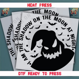 May include: DTF ready to press transfer sheets featuring a black silhouette of a character with the text "I AM THE SHADOW ON THE MOON AT NIGHT" and bat graphics. The words "HEAT PRESS" and "DTF READY TO PRESS" are also visible.