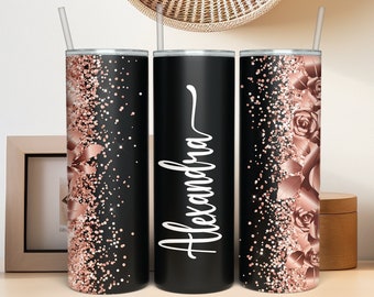 May include: Three stainless steel tumblers with black and rose gold glitter designs. The center tumbler has the name "Alexandra" written in white script.