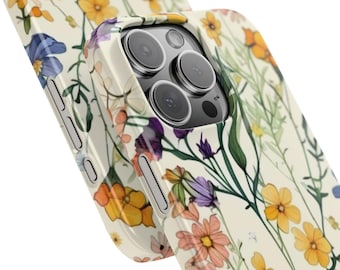 Funda para iPhone con diseño de prado de flores silvestres y estampado floral primaveral.