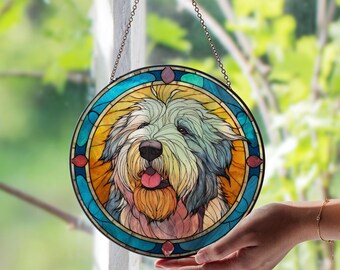 May include: Round stained glass window art featuring a dog with a long, shaggy coat and a pink tongue. The dog is surrounded by a blue and yellow border with red accents. The artwork hangs from a chain.