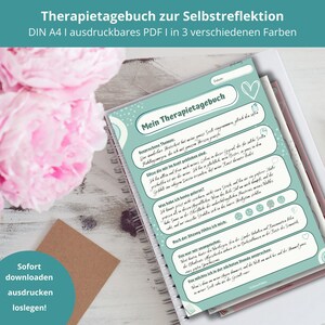 Op de afbeelding: Een bedrukbaar therapiejournaal in turquoise en wit met de titel "Mein Therapietagebuch" en de tekst "Besprechene Themen: Ein dankbarer Heiterkeit hat mir ganz viel Seele gegeben, gleich die Seele" in het Duits. Het dagboek is ontworpen voor zelfreflectie en bevat prompts om gedachten en gevoelens op te schrijven.