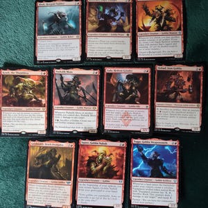 May include: Nine Magic: The Gathering trading cards arranged in three rows. The cards feature red borders and artwork depicting various goblin characters, including Rhuk, Breeches, Gut, Krark, Pashalik Mons, Zada, Slobad, Grishnakh, Squee, and Toggo.