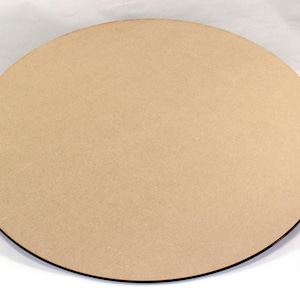 May include: A round, plain, light brown wooden craft circle. The circle is smooth and has a slightly rough texture.