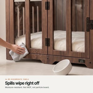Wiping the moisture-resistant 16 mm EcoComposite panel of a Classic Walnut WLO dog crate clean with a cloth, not MDF or particle board