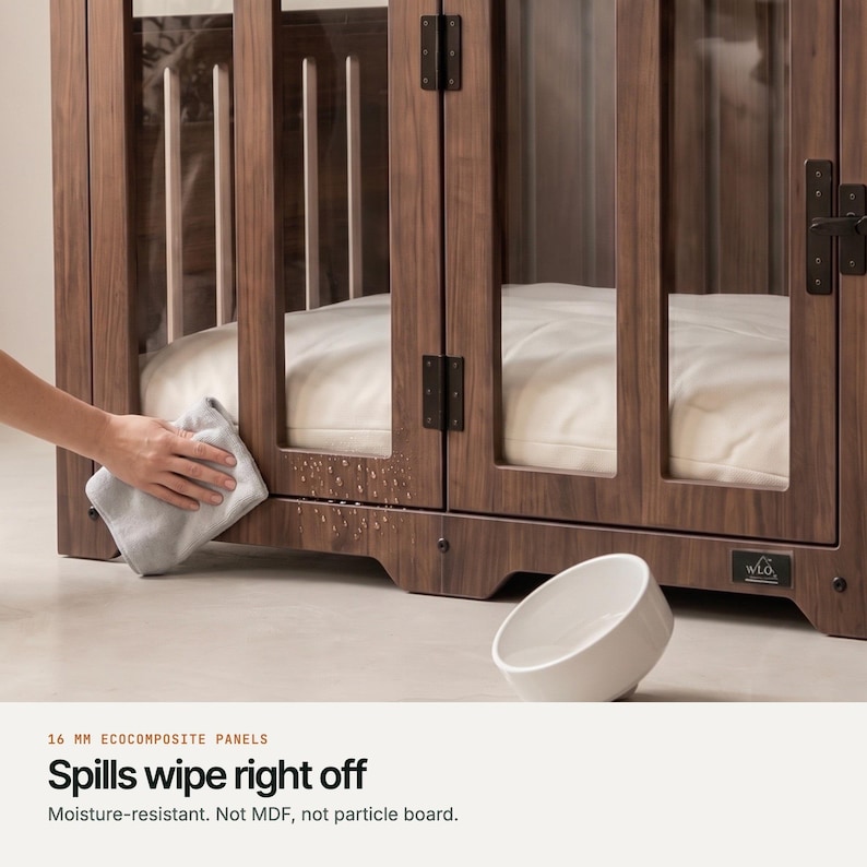 Wiping the moisture-resistant 16 mm EcoComposite panel of a Classic Walnut WLO dog crate clean with a cloth, not MDF or particle board