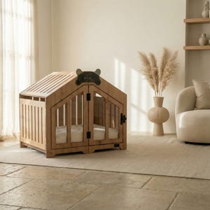 Beautiful natural-oak dog house showcased in a minimalist beige room. A modern wooden dog crate with clear panels and a soft cushion for indoor comfort. Designed to complement neutral home décor and offer your dog a calm, stylish retreat. Perfect for small and medium breeds. Ideal for Scandinavian, contemporary, and warm-toned interiors.