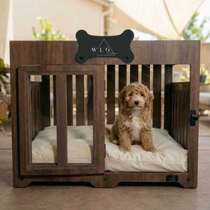 A dog resting on the cushion inside a Classic Walnut WLO Pueblo dog crate on a covered patio