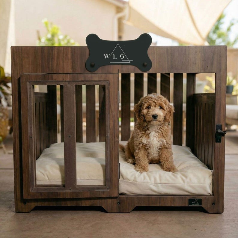 A dog resting on the cushion inside a Classic Walnut WLO Pueblo dog crate on a covered patio