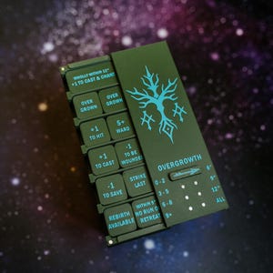 May include: A dark green game card with the word "OVERGROWTH" and a teal tree design. The card has several buttons with text like "+1 TO HIT" and "-1 TO SAVE". The background is a blurred image of a galaxy.