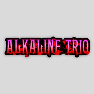 May include: Black and white sticker with the text "ALKALINE TRIO" in a red and pink gradient with red splatters behind the text.