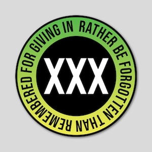 May include: A green and yellow circular sticker with the text "Remembered for giving in rather be forgotten" surrounding a black circle with the text "XXX" in white.