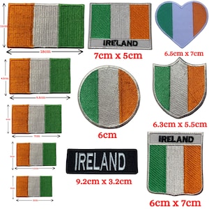 May include: Assortment of ten iron-on patches featuring the Irish flag in various shapes and sizes. The patches are green, white, and orange. Some patches include the word "IRELAND" in black text.