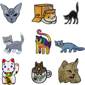 May include: Set of 10 iron-on embroidered patches featuring various cat designs. The patches include a black cat, a grey cat, a white cat, a rainbow cat, a cat in a box, a cat in a teacup, a cat with a pentagram, and a cat with a lucky charm. The patches are perfect for adding a touch of whimsy to clothing, bags, or other accessories.