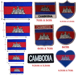 May include: A set of ten embroidered iron-on patches featuring the Cambodian flag in various shapes and sizes. The patches include a rectangular flag, a circular flag, a heart-shaped flag, and a shield-shaped flag. The patches also include the word "CAMBODIA" in white text on a black background.