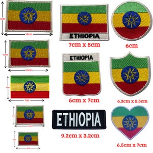 May include: Assortment of embroidered iron-on patches featuring the Ethiopian flag in various shapes and sizes, including rectangular, circular, heart, and shield shapes. The patches are all white-bordered and feature the text "ETHIOPIA" in black and white.